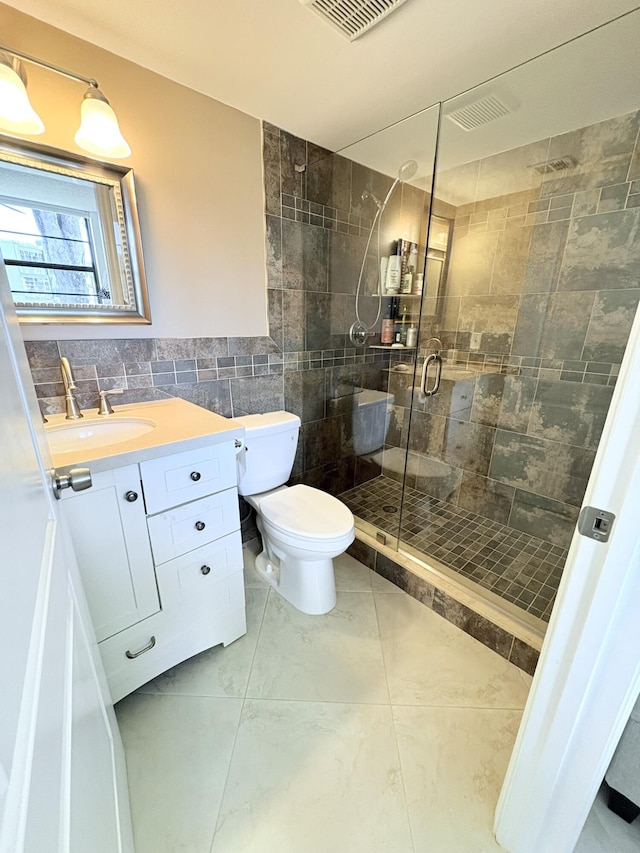 7365 NW 18th St Unit 107, Margate, FL 33063 - full bath featuring tile walls, a stall shower, vanity, and toilet