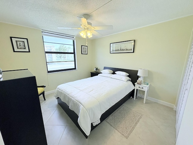 7365 NW 18th St Unit 107, Margate, FL 33063 - bedroom featuring a textured ceiling, ceiling fan, and baseboards