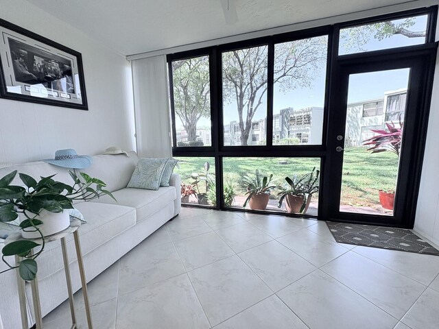 7365 NW 18th St Unit 107, Margate, FL 33063 - living room featuring plenty of natural light, expansive windows, and a view of city