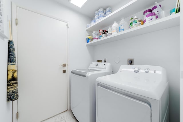 6438 Pointe Pleasant Cir, Delray Beach, FL 33484 - laundry area featuring washing machine and clothes dryer and light marble finish flooring