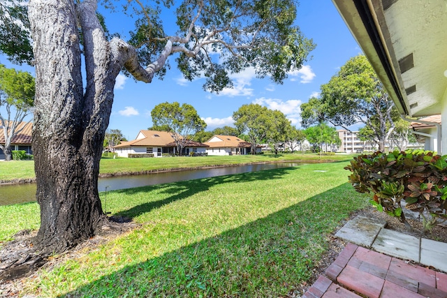 6438 Pointe Pleasant Cir, Delray Beach, FL 33484 - view of green lawn with a water view and a residential view