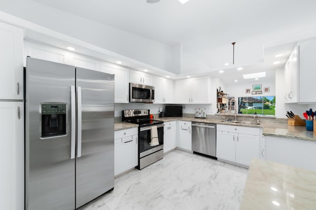 6438 Pointe Pleasant Cir, Delray Beach, FL 33484 - kitchen featuring appliances with stainless steel finishes, light marble finish flooring, white cabinetry, light stone countertops, and recessed lighting