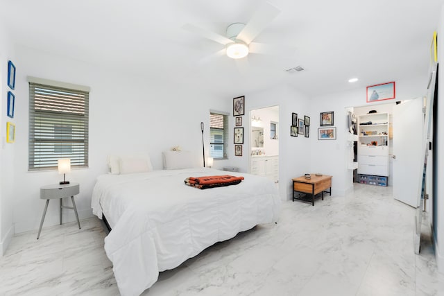 6438 Pointe Pleasant Cir, Delray Beach, FL 33484 - bedroom featuring light marble finish floors, a ceiling fan, connected bathroom, and baseboards