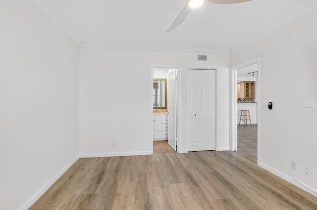 3101 S Ocean Blvd Unit 1002, Highland Beach, FL 33487 - unfurnished bedroom with ornamental molding, light wood-type flooring, baseboards, and ensuite bathroom