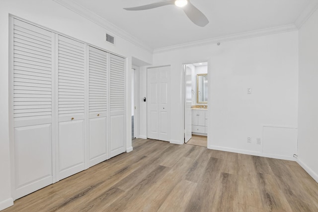 3101 S Ocean Blvd Unit 1002, Highland Beach, FL 33487 - unfurnished bedroom with crown molding, light wood-style flooring, ensuite bath, baseboards, and a ceiling fan