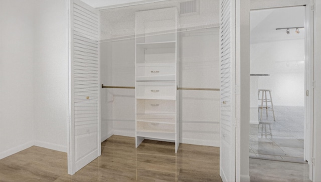 3101 S Ocean Blvd Unit 1002, Highland Beach, FL 33487 - spacious closet featuring wood finished floors