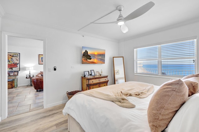 3101 S Ocean Blvd Unit 1002, Highland Beach, FL 33487 - bedroom with crown molding, baseboards, a ceiling fan, and light wood-style flooring