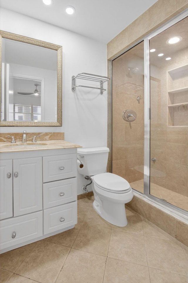 3101 S Ocean Blvd Unit 1002, Highland Beach, FL 33487 - full bathroom featuring a stall shower, toilet, vanity, tile patterned flooring, and recessed lighting