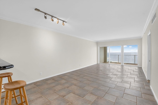 3101 S Ocean Blvd Unit 1002, Highland Beach, FL 33487 - unfurnished room featuring track lighting, baseboards, crown molding, and a water view