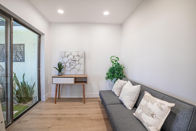 sitting room with recessed lighting, light wood-style flooring, and baseboards