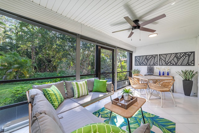 sunroom with a ceiling fan