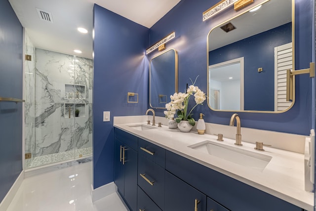 full bath with double vanity, visible vents, a marble finish shower, and a sink