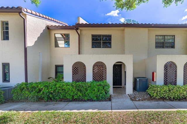 view of front of home featuring cooling unit and stucco siding