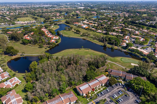 bird's eye view with a water view and golf course view