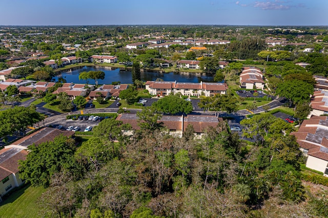 birds eye view of property with a residential view and a water view