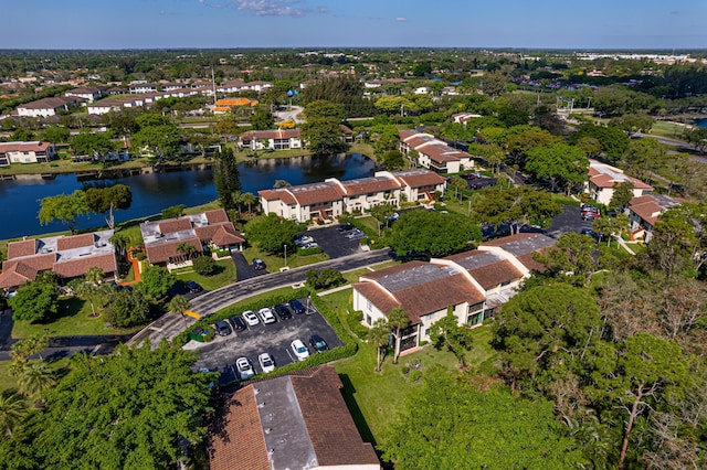 birds eye view of property with a residential view and a water view