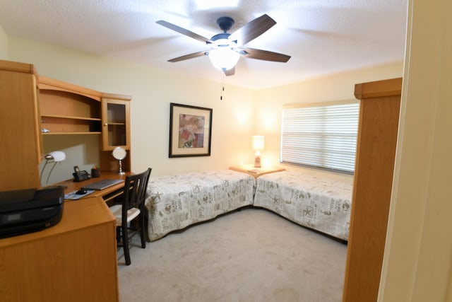 15 Southport Ln Unit E, Boynton Beach, FL 33436 - bedroom with light colored carpet and ceiling fan