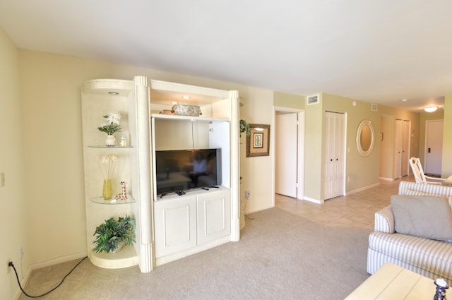 15 Southport Ln Unit E, Boynton Beach, FL 33436 - tiled living room with carpet, visible vents, and baseboards
