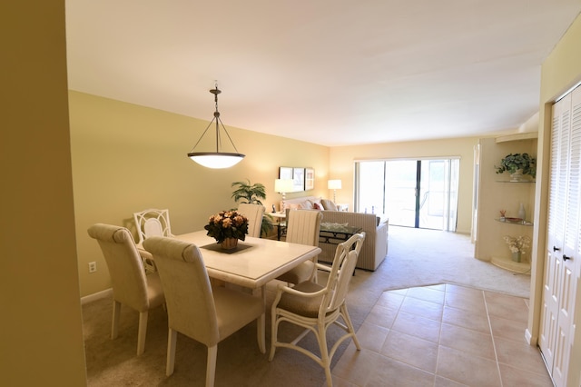 15 Southport Ln Unit E, Boynton Beach, FL 33436 - dining room featuring light tile patterned floors and light colored carpet