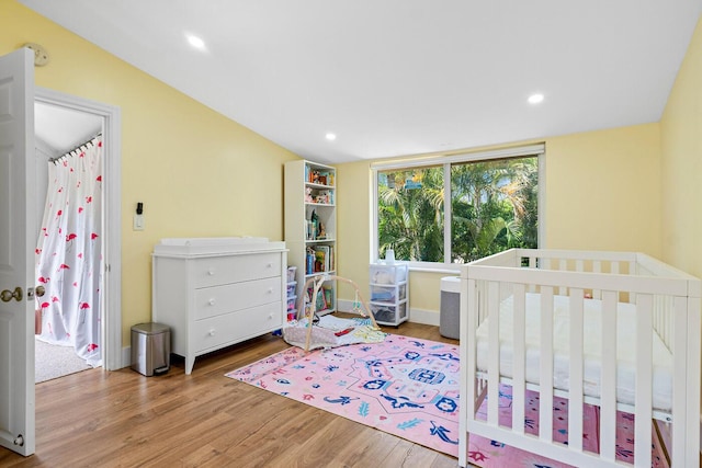 bedroom featuring recessed lighting and wood finished floors