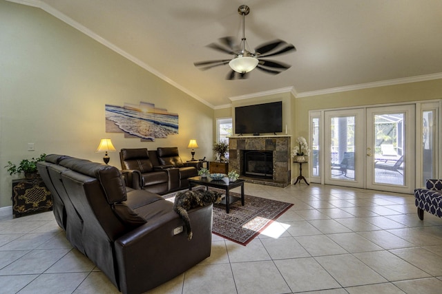 living room with light tile patterned floors, ceiling fan, crown molding, and vaulted ceiling