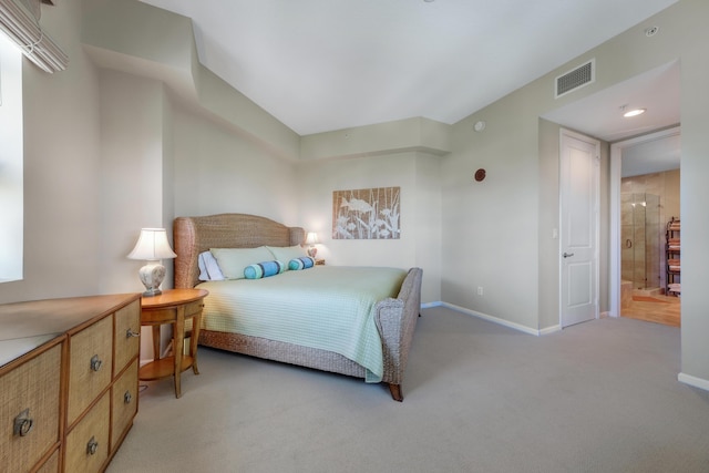 bedroom featuring visible vents, baseboards, and light colored carpet