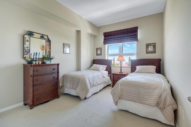 bedroom with carpet flooring and baseboards