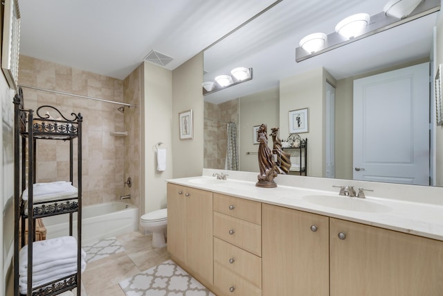 full bath with double vanity, visible vents, toilet, and a sink