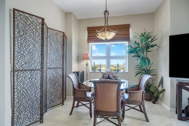 dining area featuring baseboards