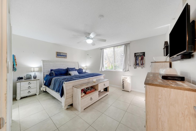 500 Scotia Dr Unit 106, Hypoluxo, FL 33462 - bedroom with ceiling fan, light tile patterned flooring, and a textured ceiling