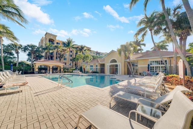 500 Scotia Dr Unit 106, Hypoluxo, FL 33462 - community pool featuring a gazebo and a patio area