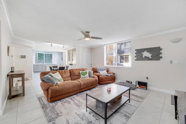 500 Scotia Dr Unit 106, Hypoluxo, FL 33462 - living area featuring baseboards, a ceiling fan, ornamental molding, and light tile patterned floors
