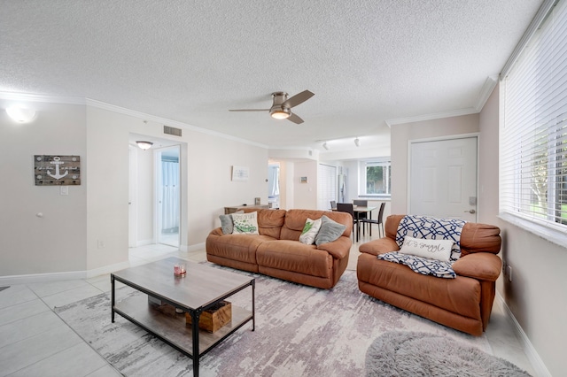 500 Scotia Dr Unit 106, Hypoluxo, FL 33462 - living room with a ceiling fan, visible vents, a textured ceiling, and crown molding