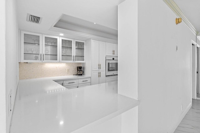 2000 S Ocean Blvd Unit 301, Delray Beach, FL 33483 - kitchen featuring visible vents, glass insert cabinets, oven, light countertops, and marble finish floor