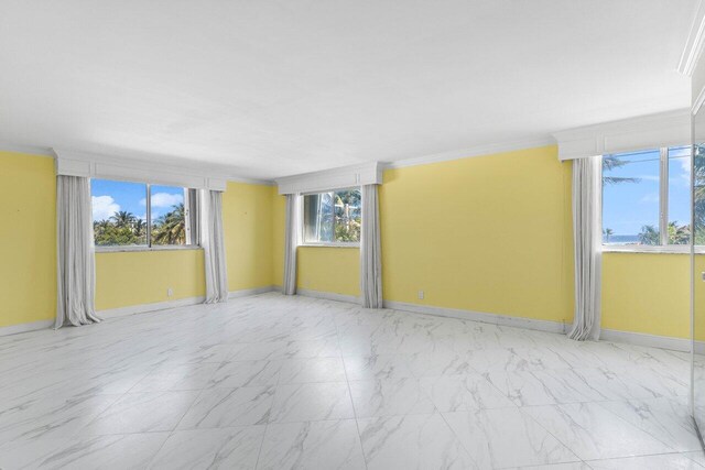 2000 S Ocean Blvd Unit 301, Delray Beach, FL 33483 - spare room with baseboards, marble finish floor, and crown molding