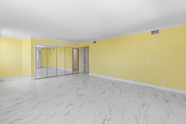 2000 S Ocean Blvd Unit 301, Delray Beach, FL 33483 - unfurnished bedroom with visible vents, baseboards, and ornamental molding