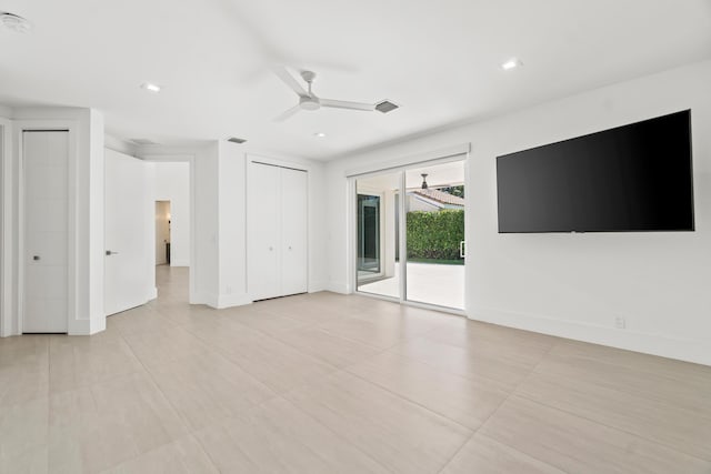 interior space with visible vents, ceiling fan, baseboards, and access to outside