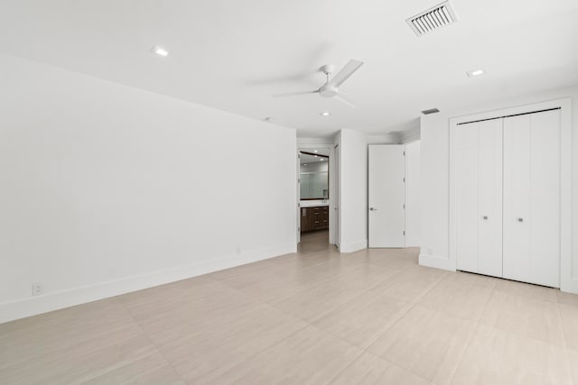 unfurnished bedroom with baseboards, visible vents, recessed lighting, ceiling fan, and connected bathroom