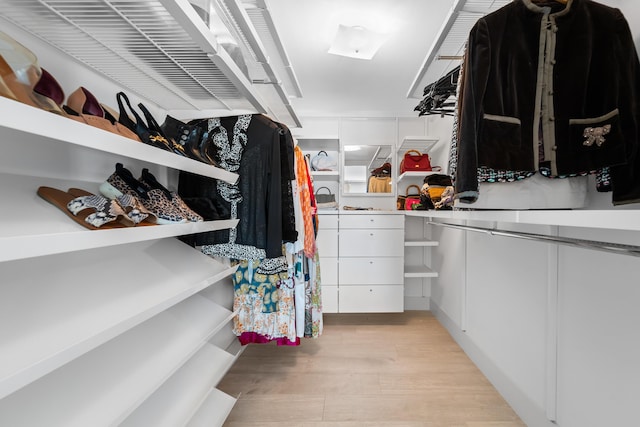 spacious closet featuring light wood-type flooring