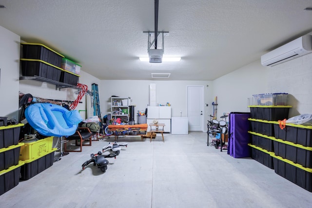 garage featuring a wall mounted air conditioner