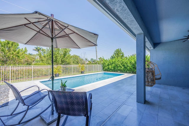 view of swimming pool with a patio, a fenced backyard, and a fenced in pool