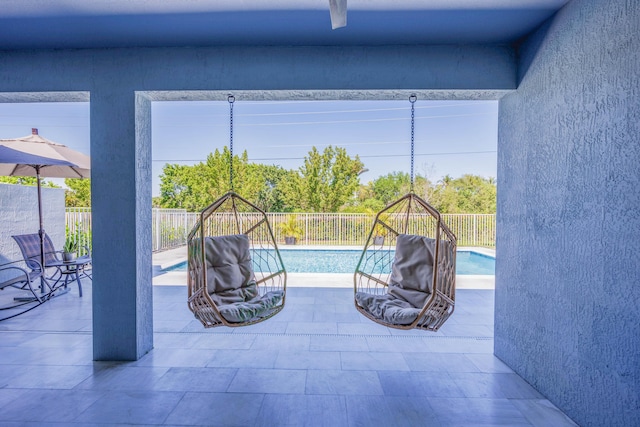 view of swimming pool with a fenced in pool, a patio, and a fenced backyard