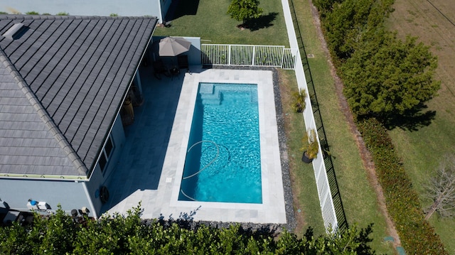 outdoor pool featuring fence