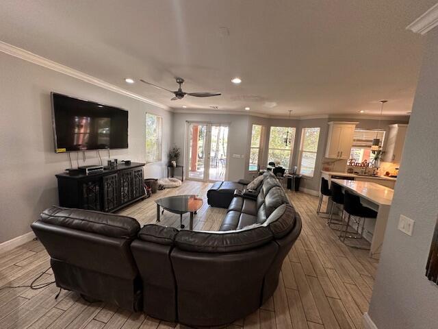 entrance foyer with stairway, baseboards, wood finished floors, and a towering ceiling