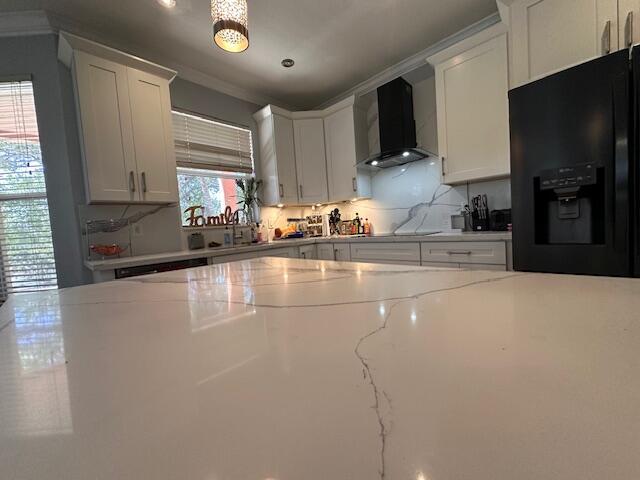 dining room with a notable chandelier, baseboards, crown molding, and light wood-style floors