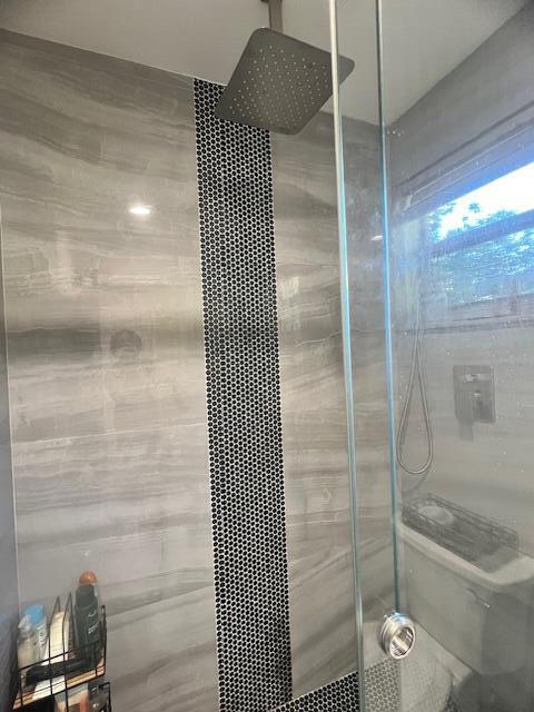 bathroom featuring a shower stall