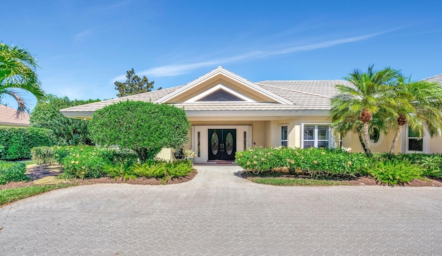 view of front of house featuring french doors and stucco siding