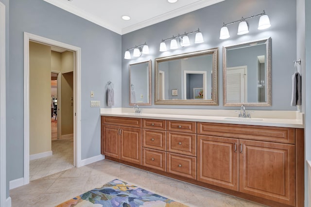 full bathroom featuring crown molding, double vanity, baseboards, and a sink