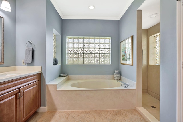 full bathroom with ornamental molding, vanity, and a bath