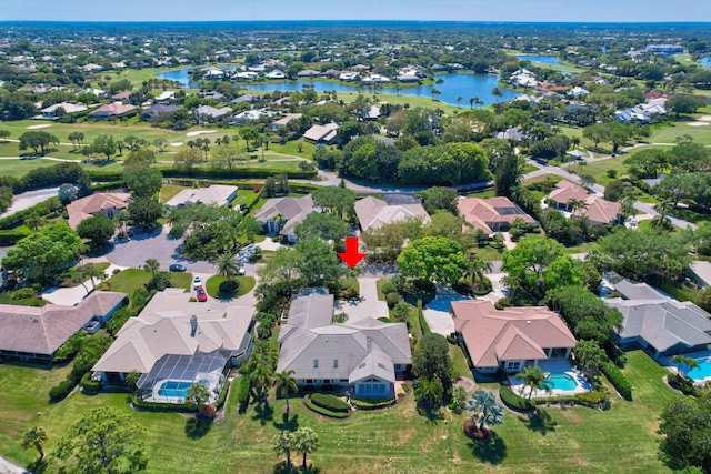 drone / aerial view featuring a residential view and a water view